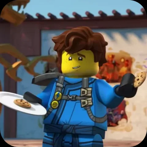 Анимация персонажа Джея из LEGO Ninjago, который протягивает печенье.
