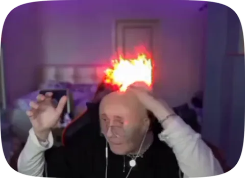 Мужчина с горящей головой жестикулирует руками