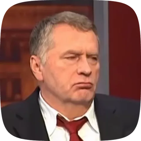 Пожилой мужчина в темном костюме и красном галстуке, нахмурившись, смотрит в сторону с недоверием.