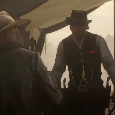 Анимация из игры Red Dead Redemption 2: ковбой с усами в тёмной шляпе и жилете разговаривает с другим персонажем в лагере и закуривает.
