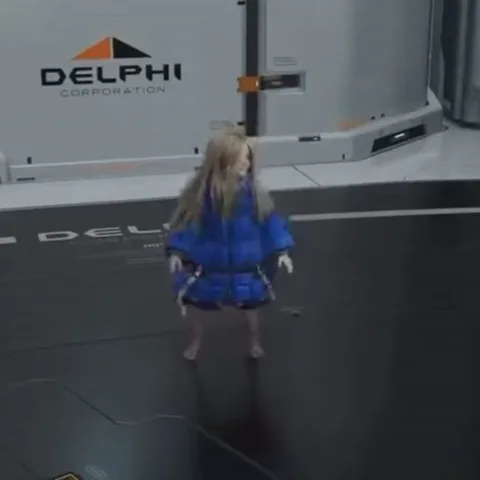 Анимация 3D-персонажа: девушка в огромной синей куртке-пуховике весело крутится на месте в футуристичном интерьере.