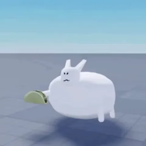3D-анимация белого существа с ушами, которое держит в лапке тако и ест его.