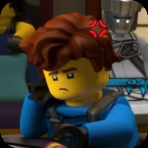 Анимация персонажа Джея из LEGO Ninjago в синем костюме, который сердито смотрит в сторону с красным знаком гнева над головой.