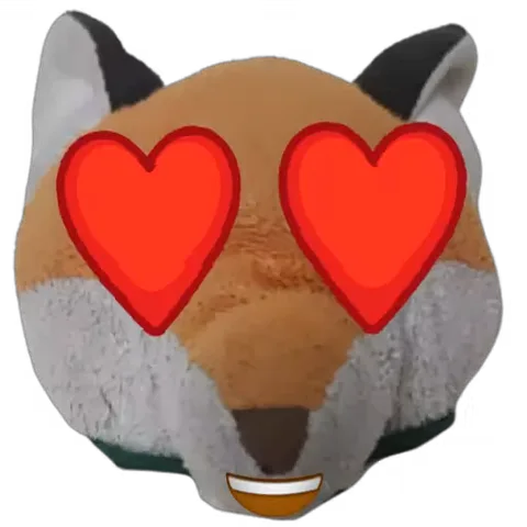 Анимированный стикер с плюшевой головой рыжего лиса, у которого вместо глаз большие красные сердца.
