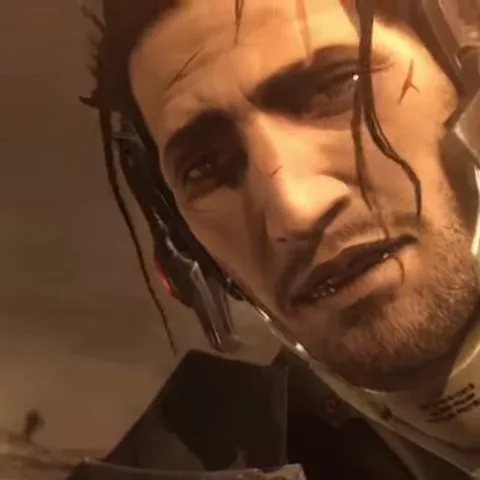 Анимация из игры Metal Gear Rising: Revengeance. Сначала крупным планом показано лицо киборга Рейдена с выражением печали и усталости. Затем происходит резкий переход, и камера показывает его тело в белом высокотехнологичном костюме, лежащим на земле рядом с мечом.